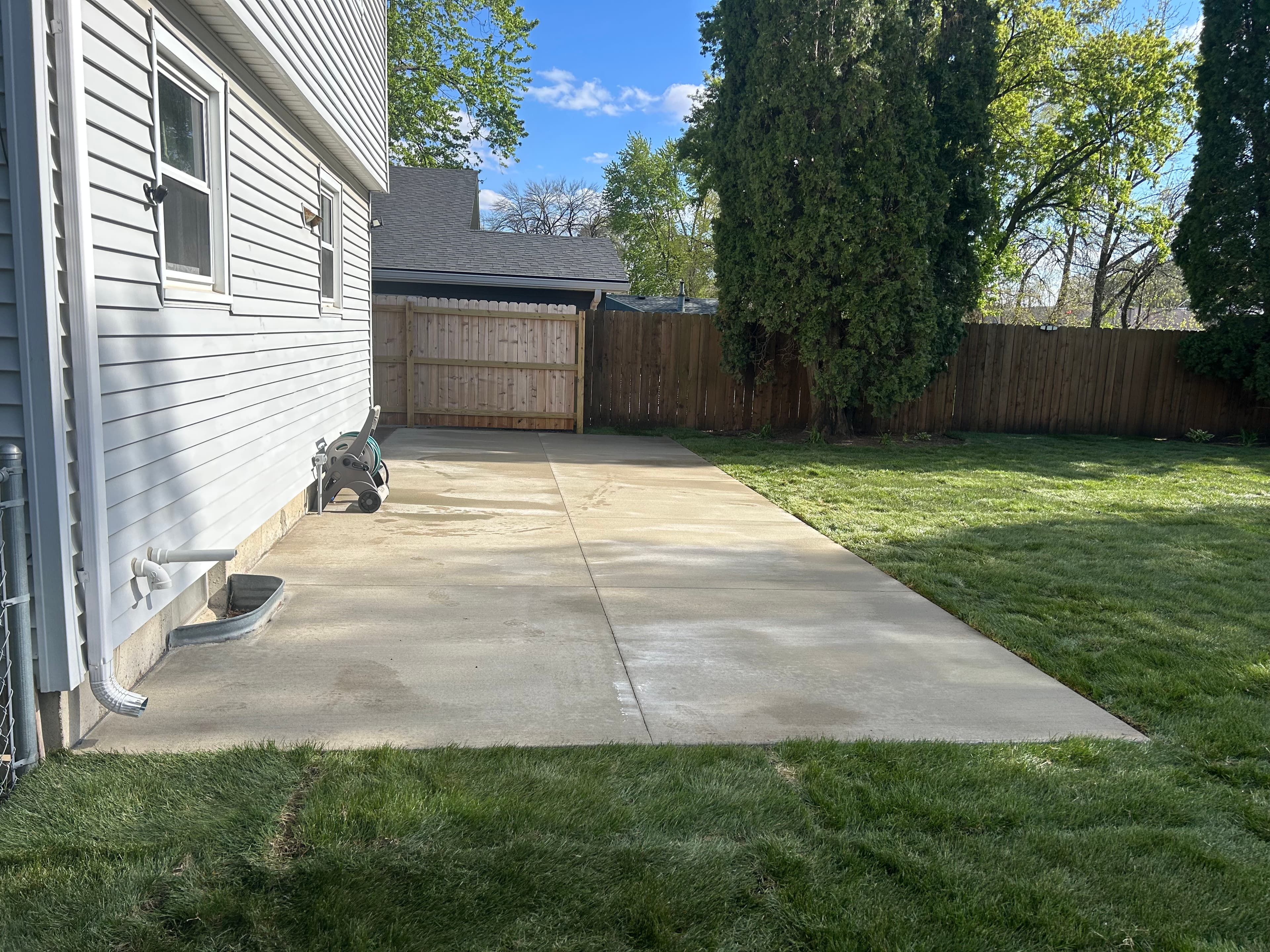 Project Concrete Patio and Fresh Sod Turn a Backyard Into Something Usable image