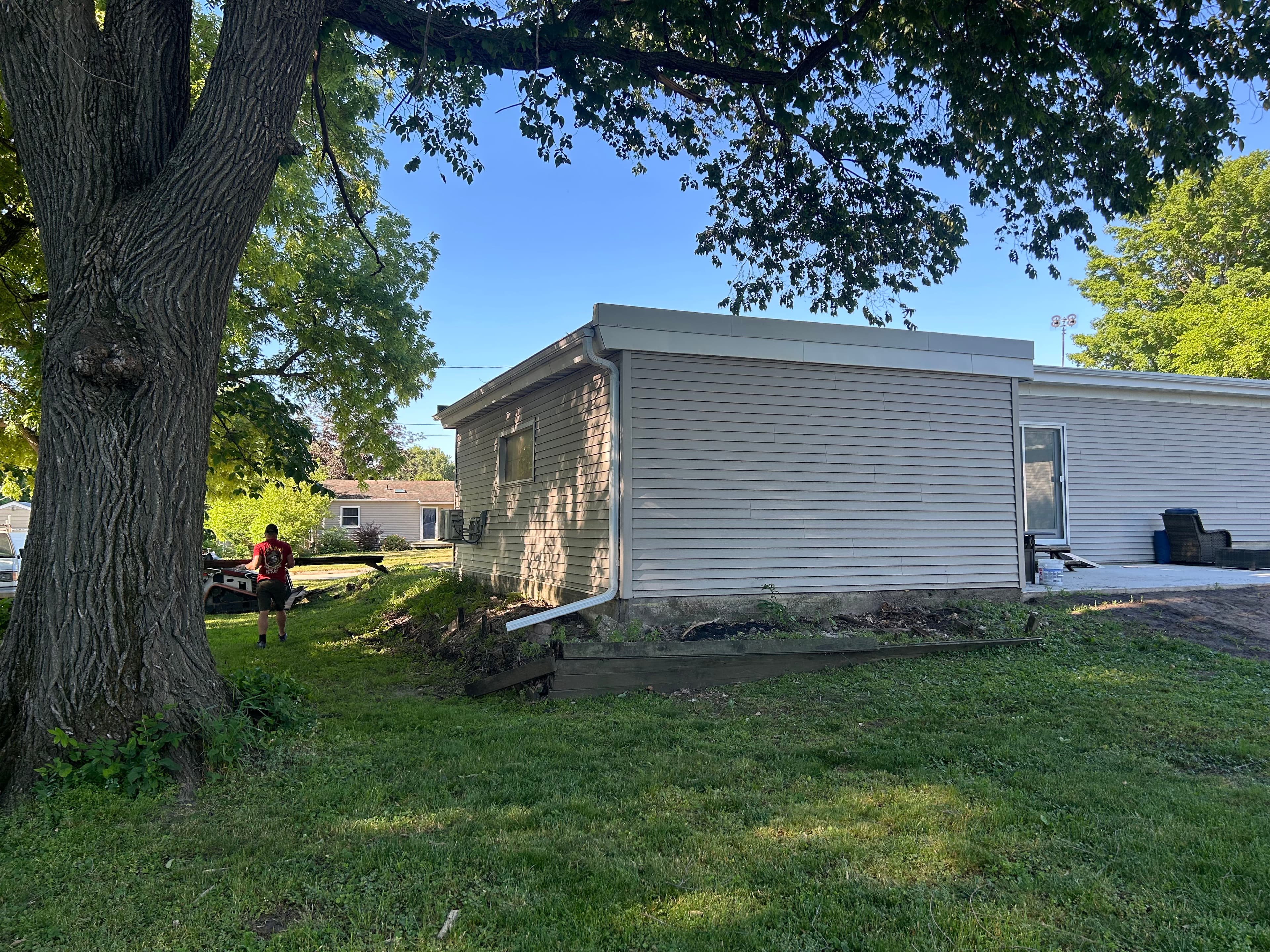 Project Retaining Wall Removal and Sod Installation Turns Yard Around image
