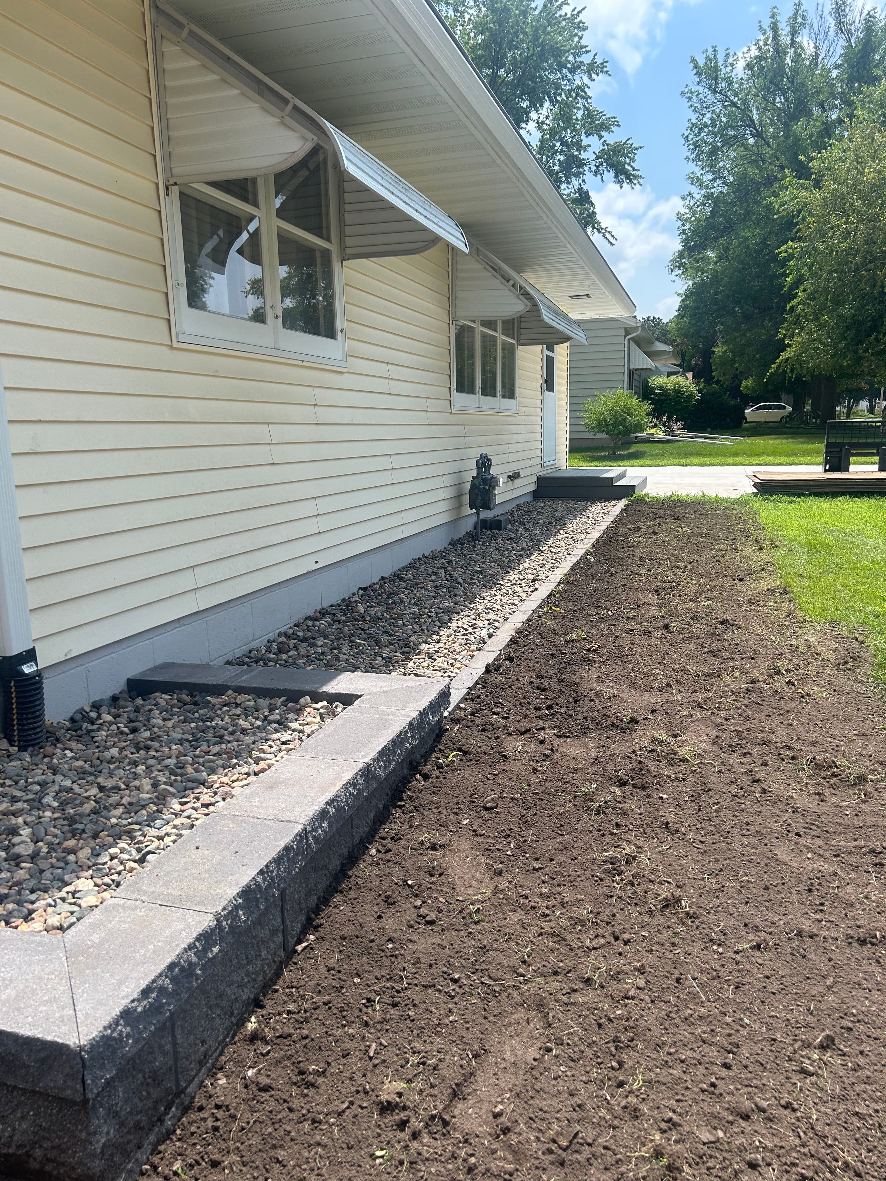 Project Retaining Walls, Rock Beds, Stamped Patio and More - Full Yard Overhaul image