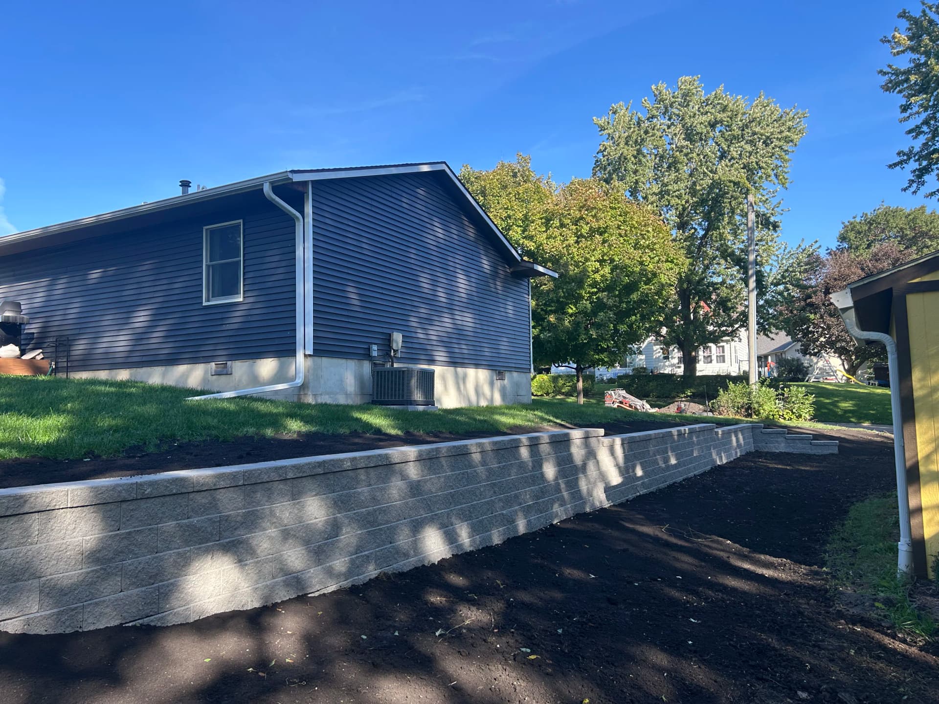 Gallery photos for Retaining Wall Built to Hold Slope and Reclaim Yard Space: Image #1